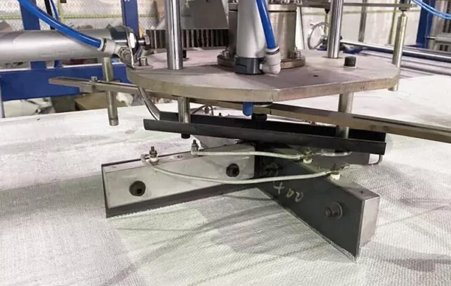 The woven fabric is cut into specific shapes and sizes, ensuring accurate dimensions for the bag's design