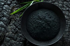 The charcoal will absorb the plastic smell