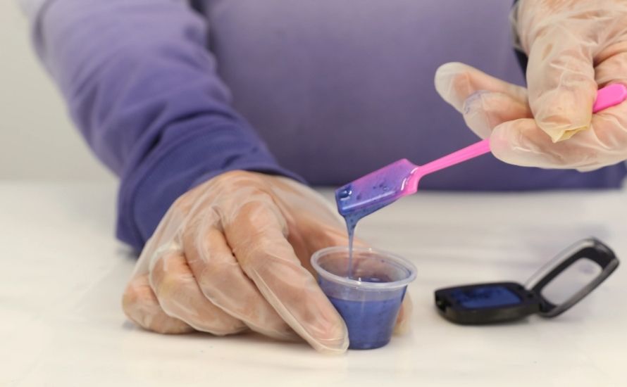 Mixing colorants with resin before injection ensures even distribution for a uniform molding color in the final product