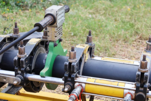 The method of butt fusion involves heating and applying pressure to the extreme ends of two HDPE pipes.